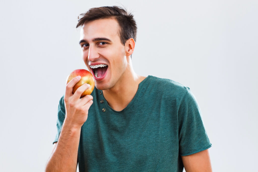 When eating with braces, it's crucial to avoid hazardous foods and take the proper precautions to protect your oral appliances.